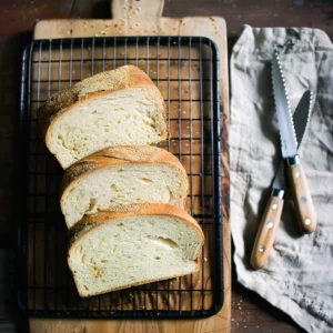 same day sourdough sandwich bread recipe loaf cooling on rack